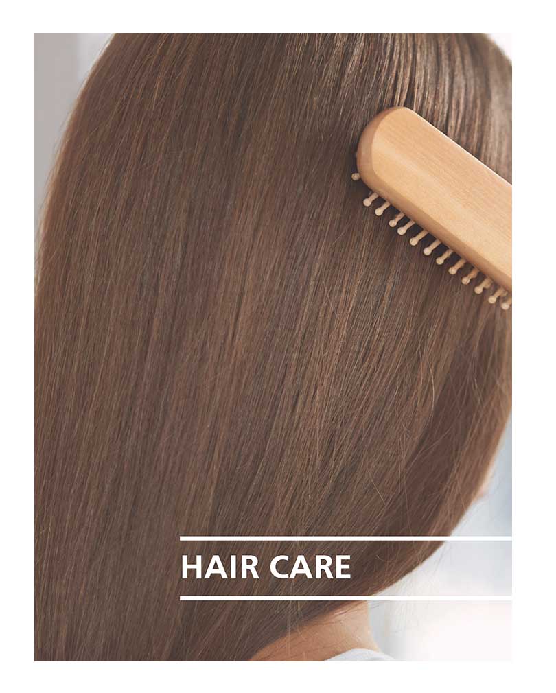 Ladies brunette hair being brushed